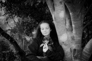 black and white photo of girl and dog
