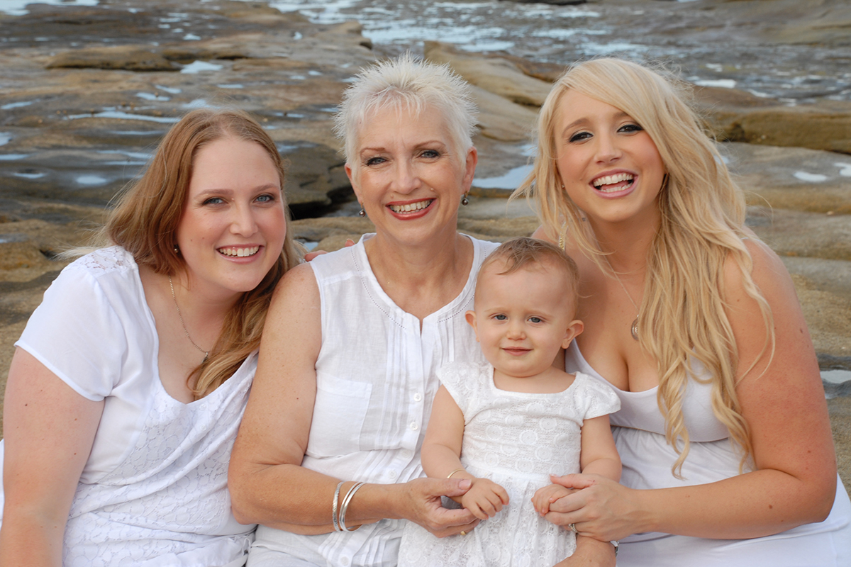 Mother, daughters and grand daughter at beach