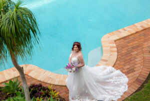 bride next to swimming pool