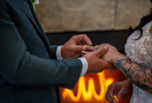 Groom placing ring