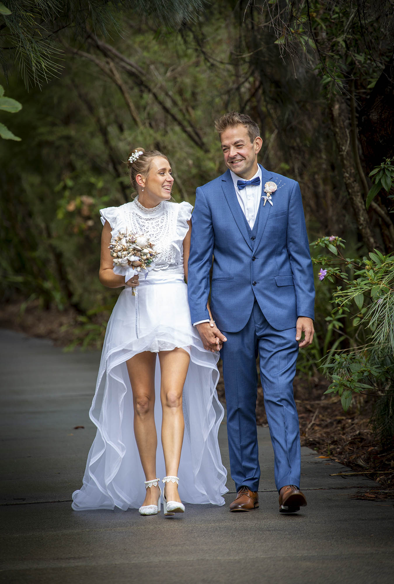 Bridal-couple-walking-smiling-Malenyweddingphotography bridal couple walking smiling Maleny wedding photography
