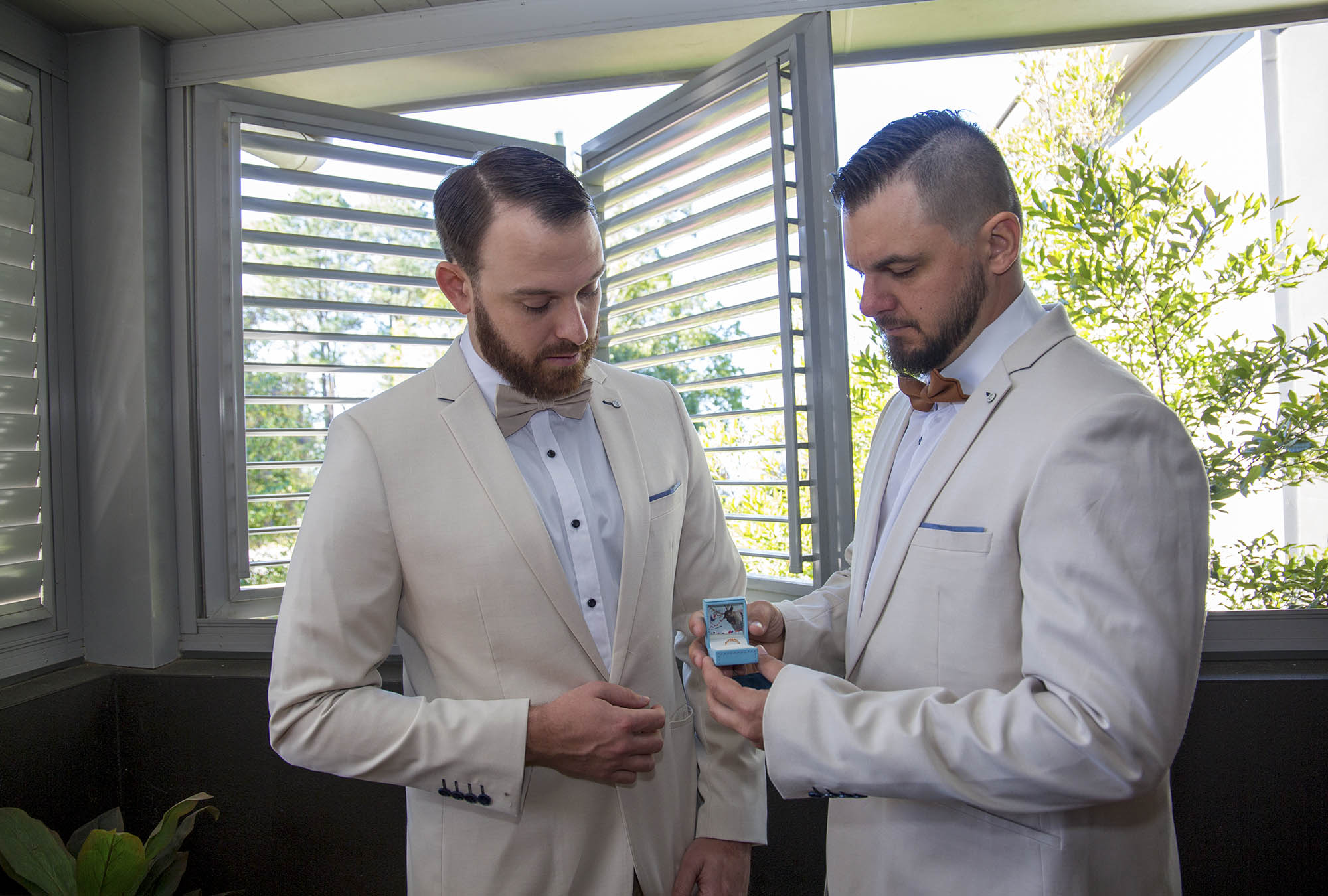 best-man-groom-wedding-rings-Malenyweddingphotography best man and groom looking at wedding rings Maleny wedding photography