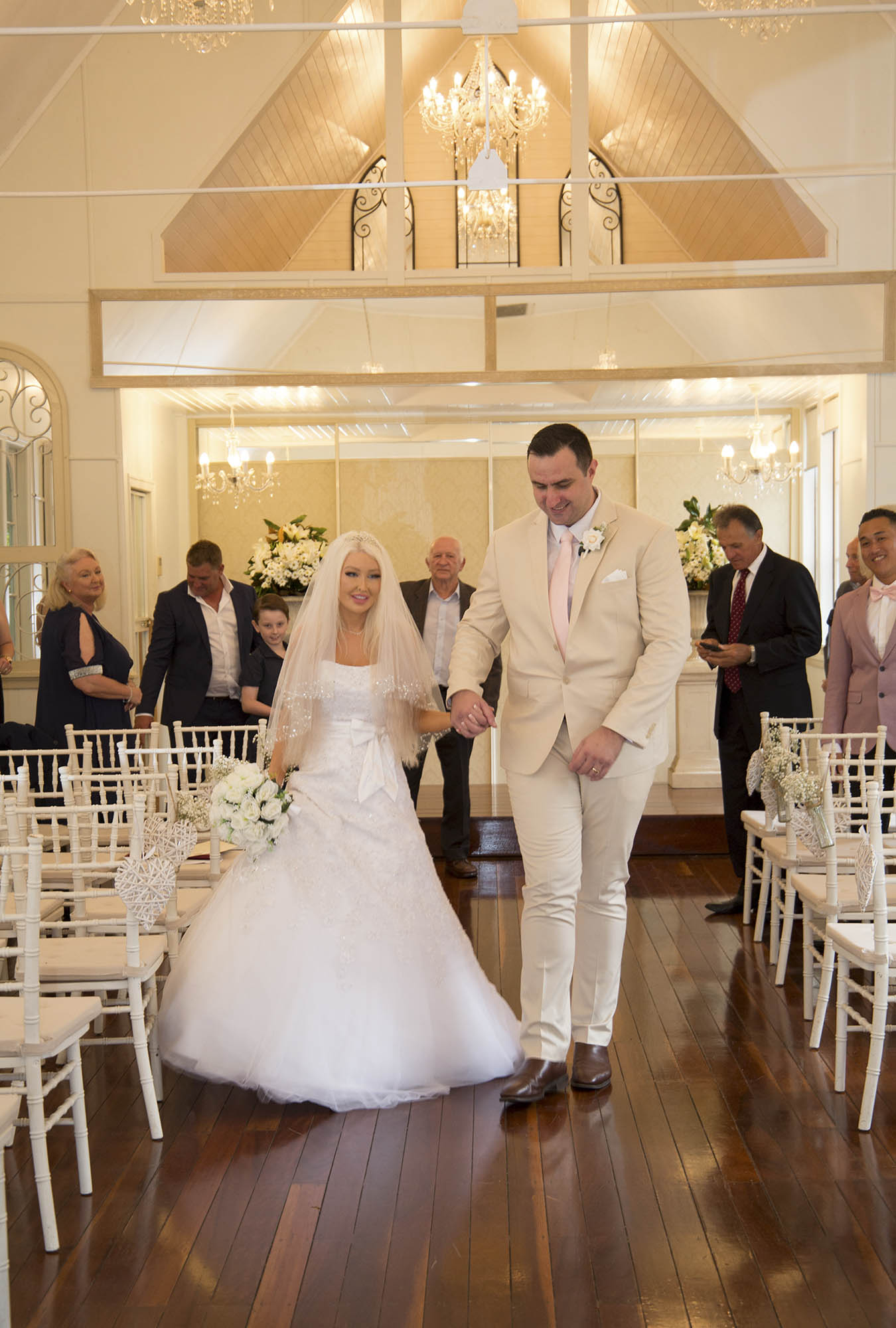 bride-groom-white-wedding-chapel-malenyweddingphotography bridal couple walking down aisle at Little white wedding chapel Maleny wedding photography