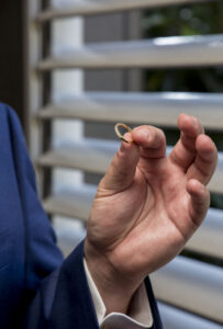 groom holding wedding ring Maleny wedding photography